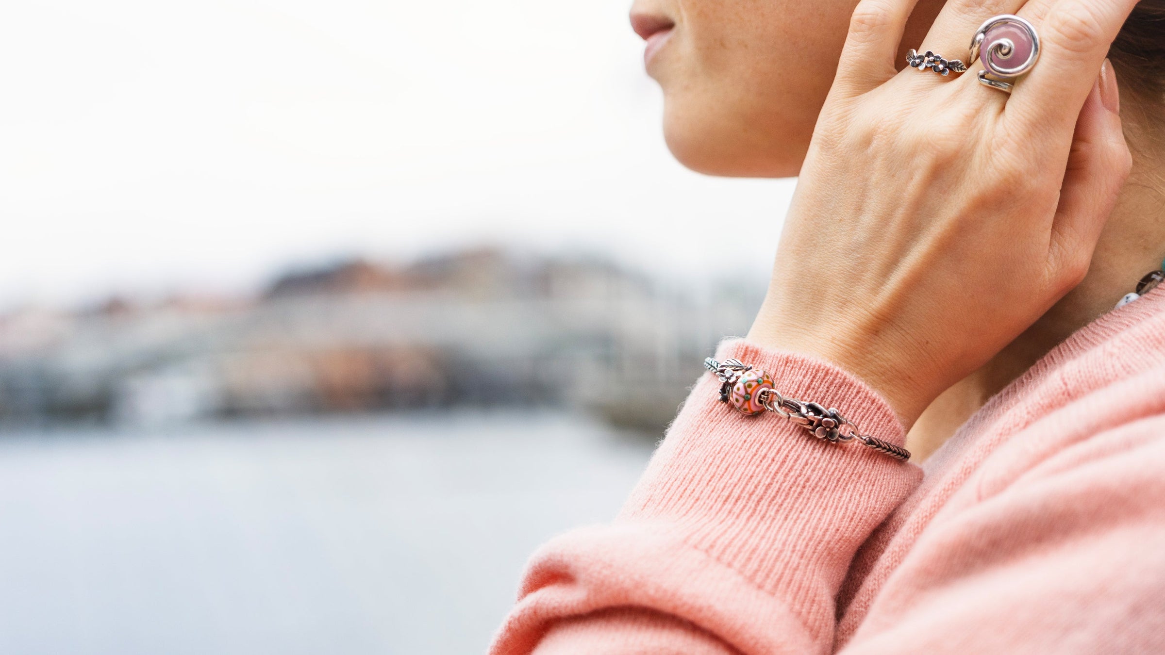 Lakeside Bloom spring bracelet on model with Spring-inspired rings